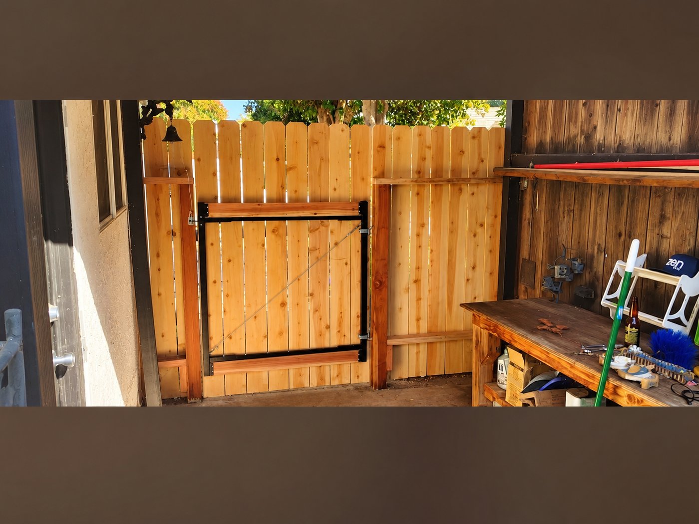 Custom redwood fence and gate carpentry — Stockton backyard project by Cazares Construction